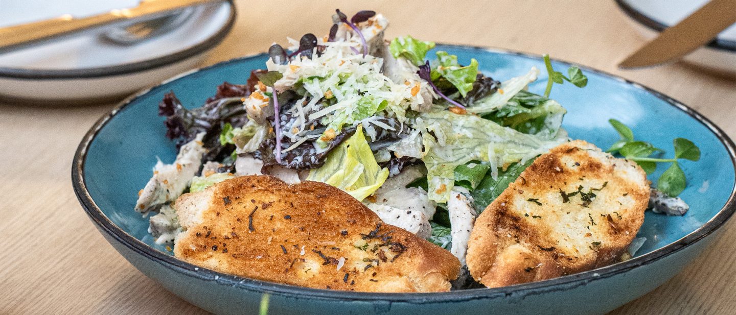 A plate of salad and bread at the Smoke House Deli in the Indiranagar district of Bengaluru