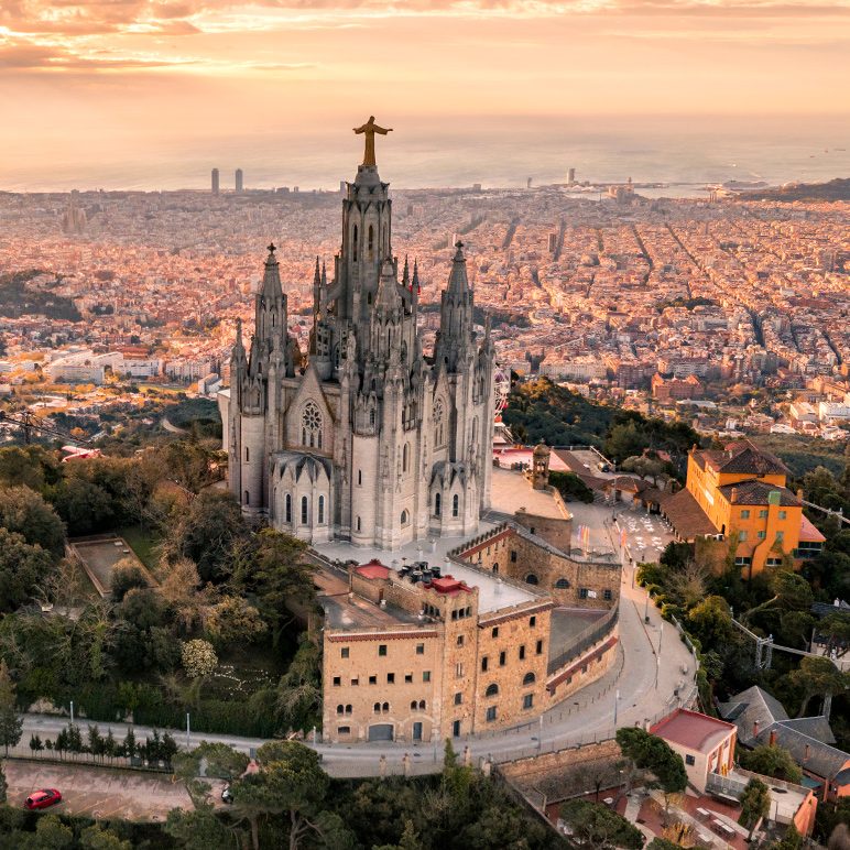 Tibidabo with the Sagrat Cor Church overlooking Barcelona at sunset