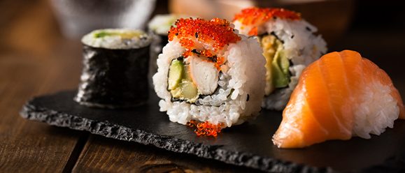Close-up of sushi on a slate plate