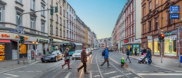 Pedestrians cross an intersection in Frankfurt am Main