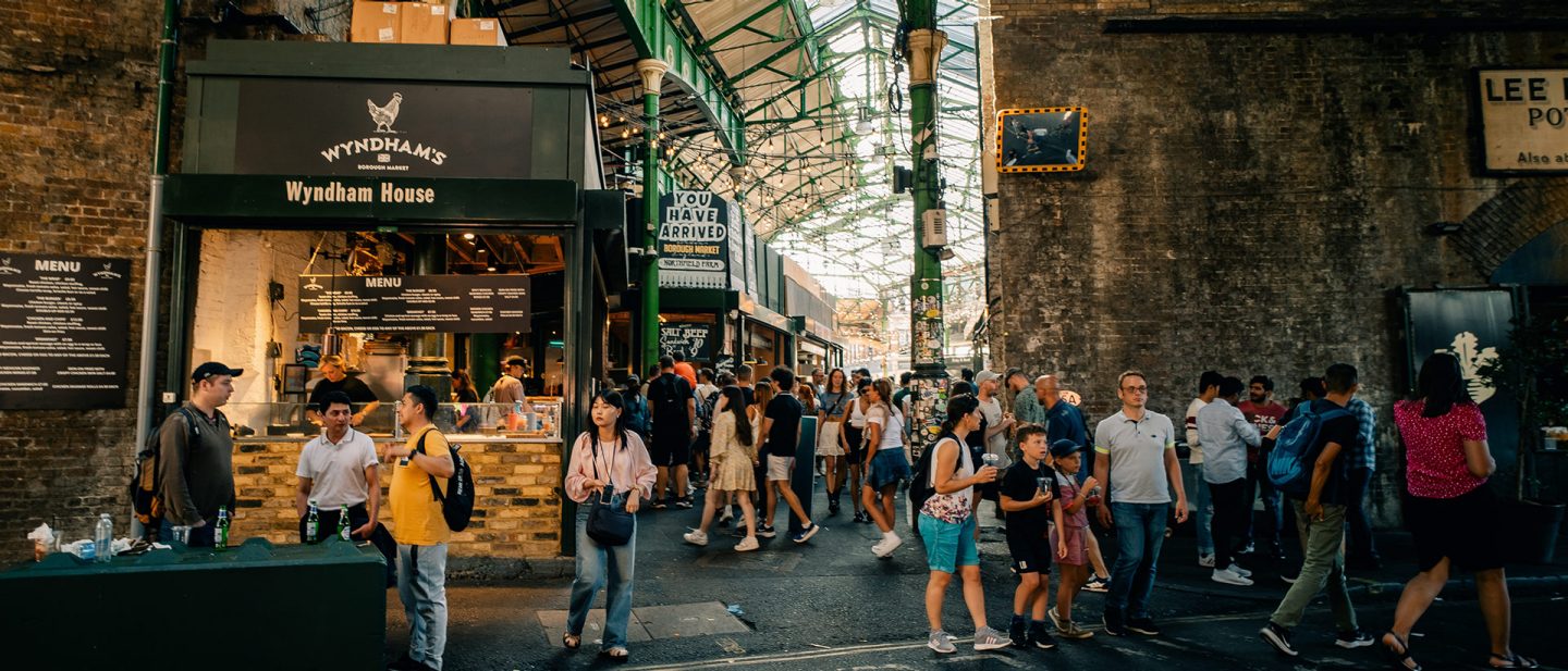 People stroll through the halls of Borough Market