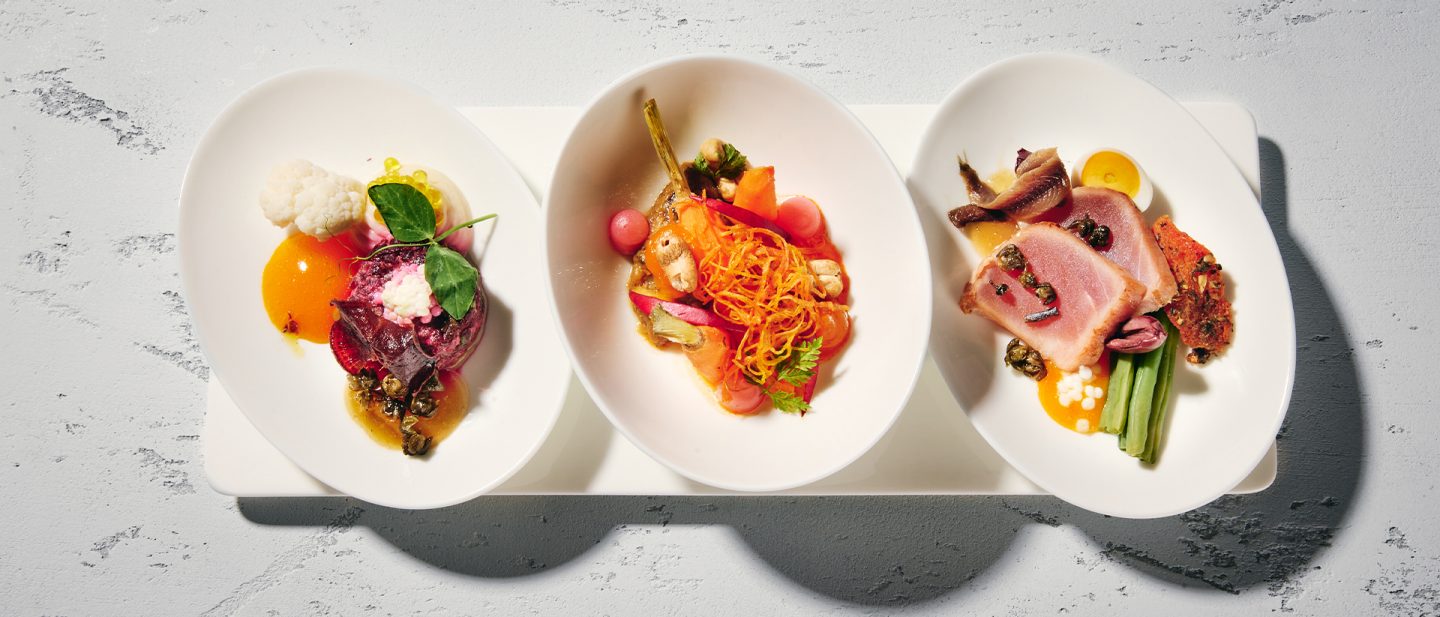  Three plates of assorted high-quality appetizers