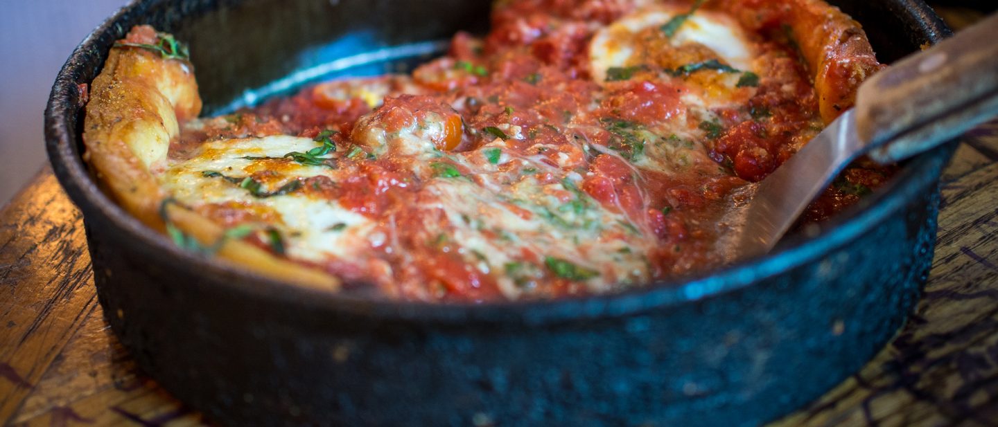 Pizza in a cast iron pan.