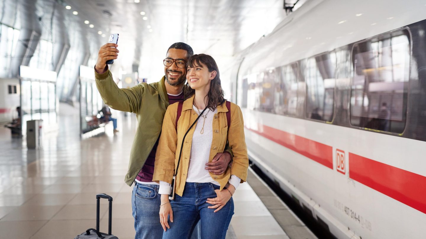 Smiling couple taking a selfie.