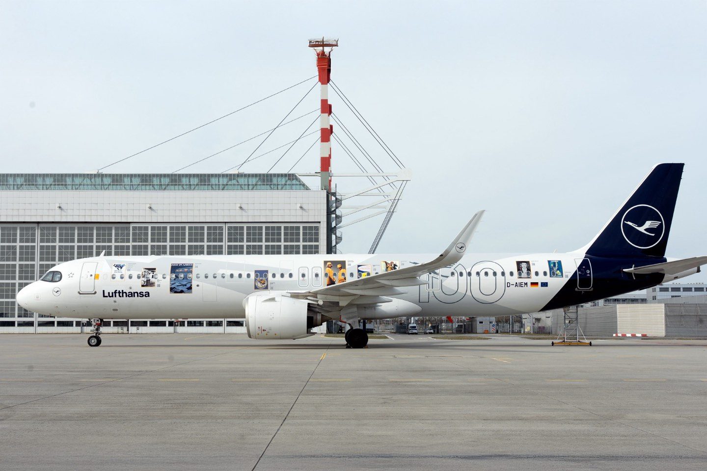 Lufthansa Airbus A321neo with a special anniversary livery at an airport.