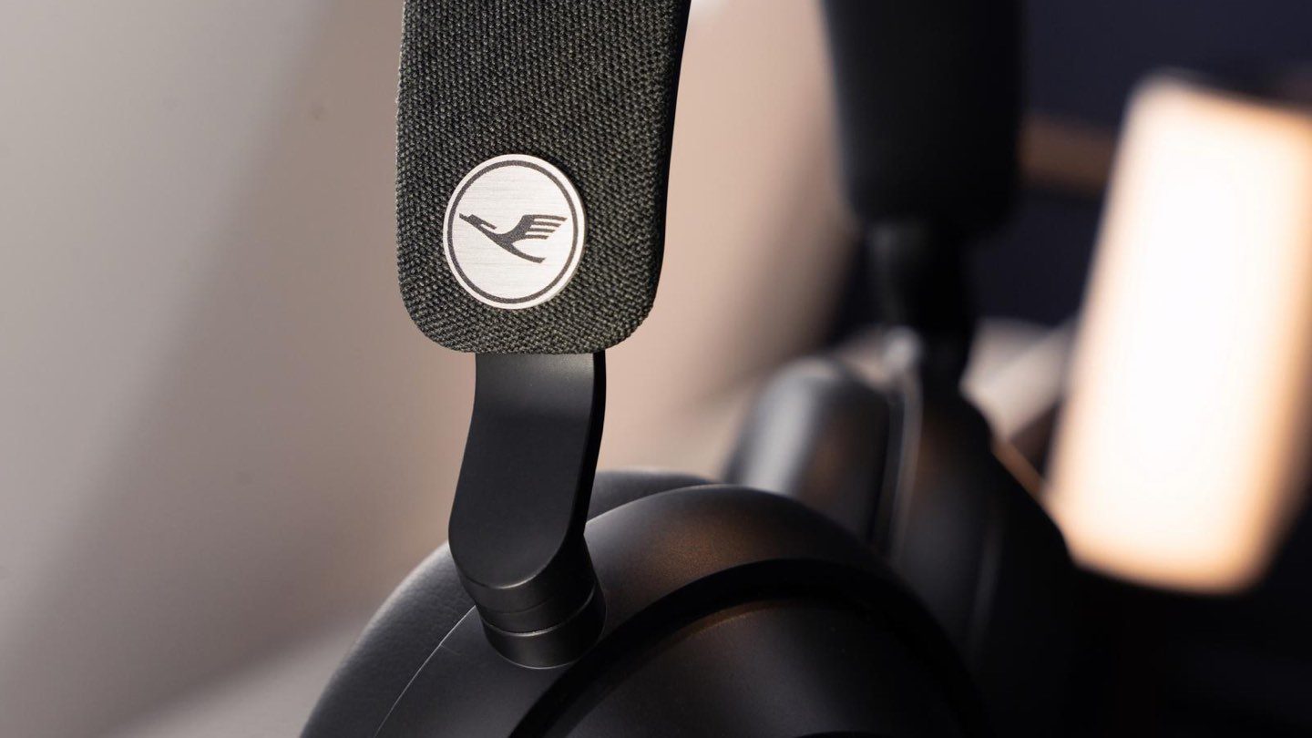 Premium black headphones with Lufthansa logo, ready for your flight.