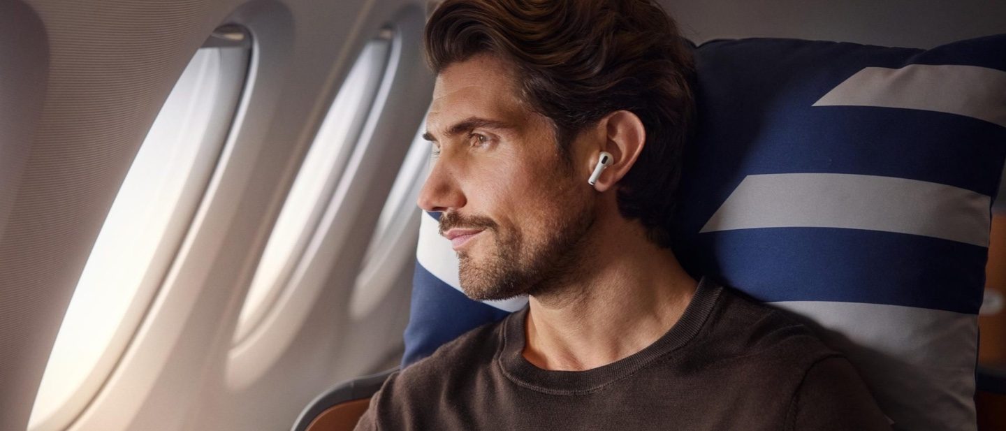 We’ve thought of everything: a male passenger enjoys his flight.