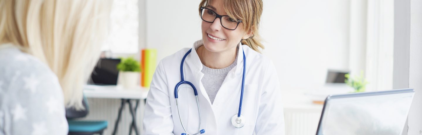 Female doctor talking to patient