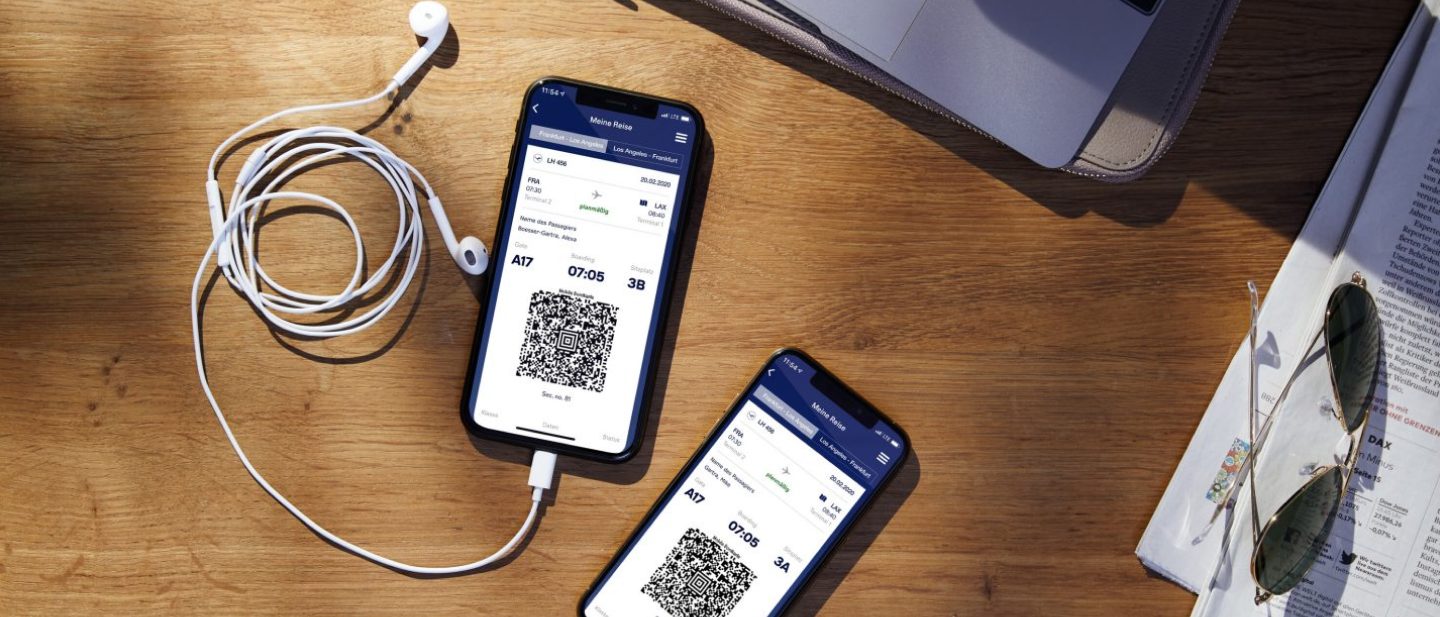Two smartphones displaying digital boarding passes issued after online check-in.