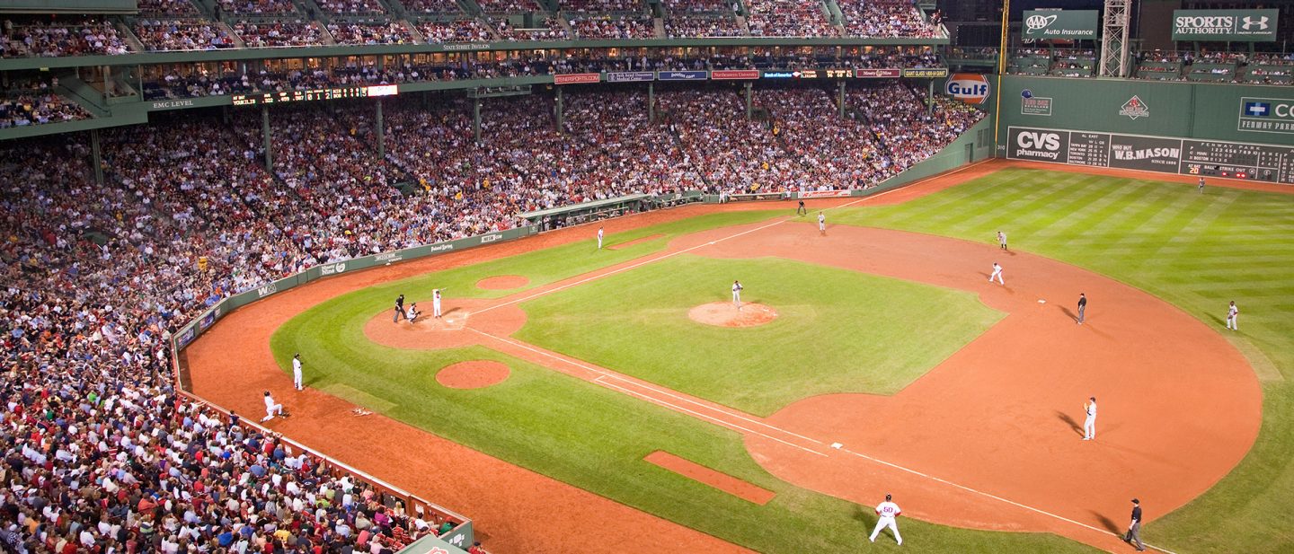 Baseball game in a crowded stadium viewed from above