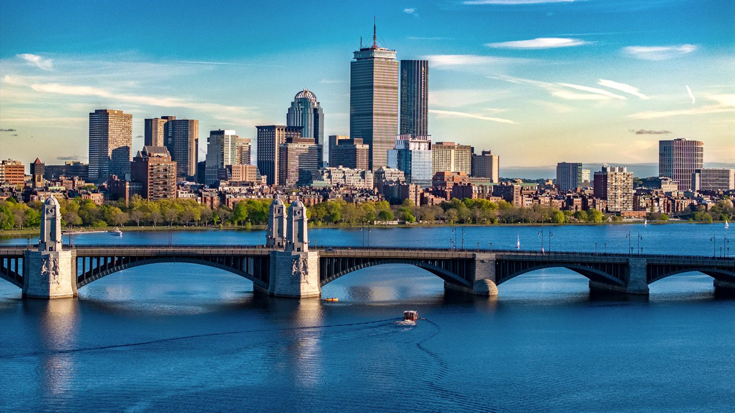 Boston skyline with a bridge over the Charles River on a clear day