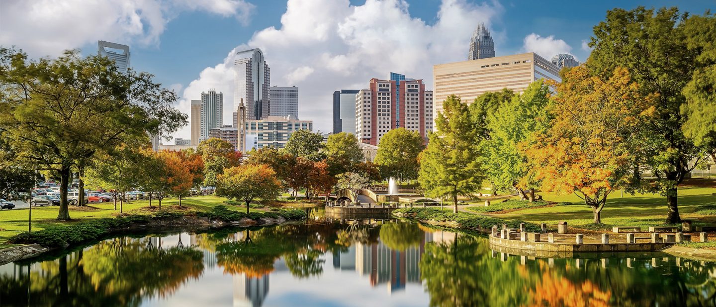 Charlotte skyline with Marshall Park in the foreground on a sunny fall day
