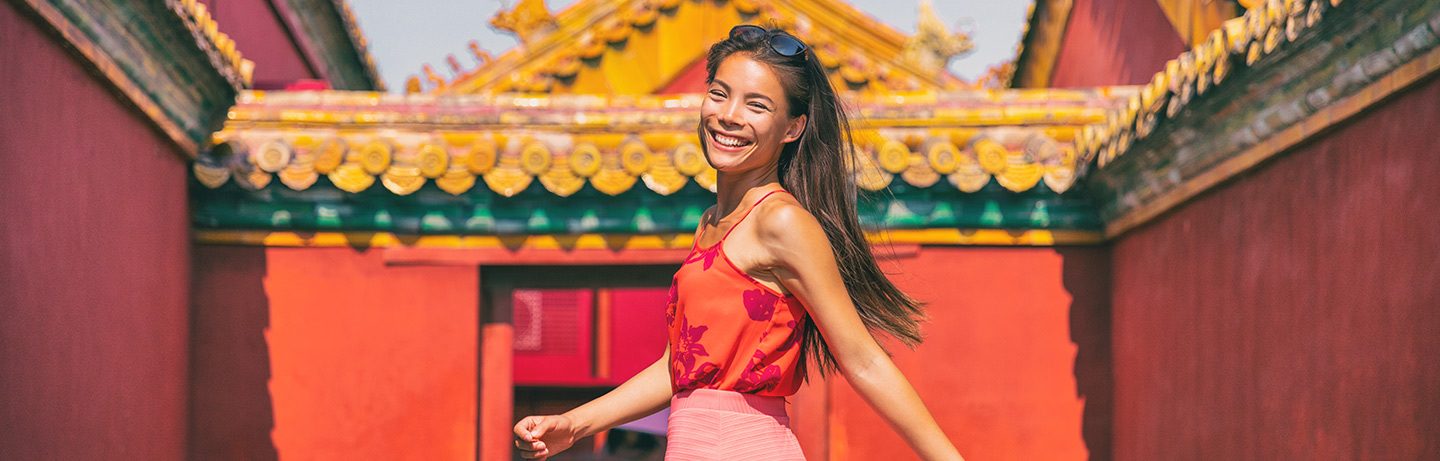 Smiling woman in Beijing's Forbidden City